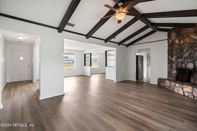 unfurnished living room featuring a fireplace, visible vents, ceiling fan, and wood finished floors