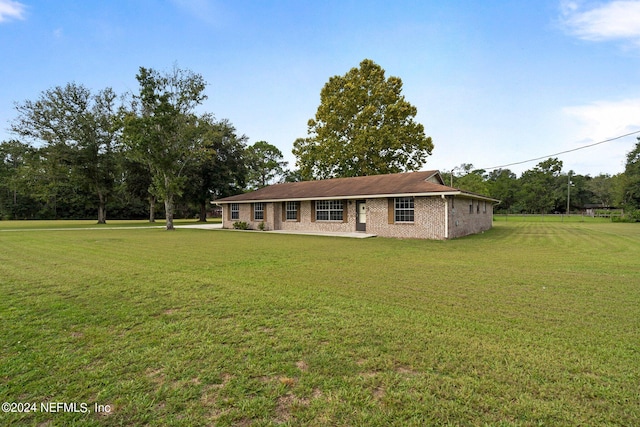 back of property with a lawn