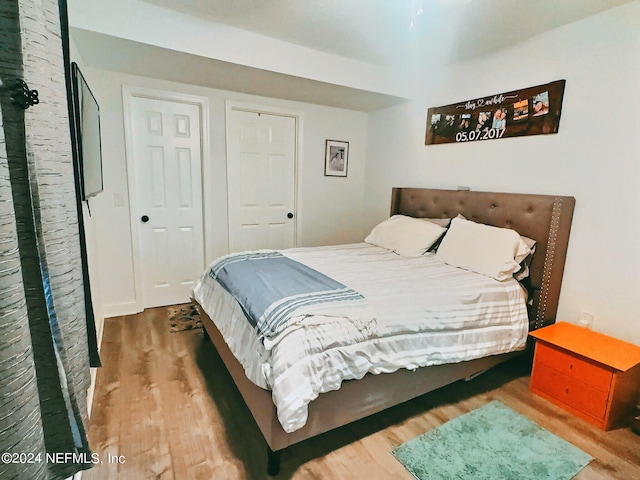 bedroom featuring hardwood / wood-style floors