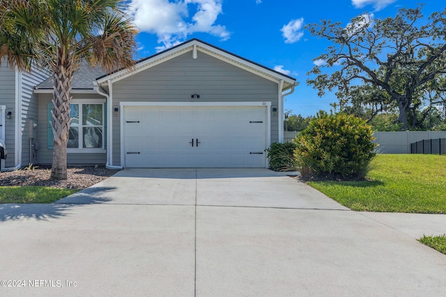 view of property exterior with a yard and a garage