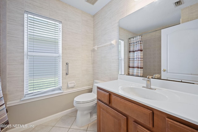 96316 Ridgewood Cir, Fernandina Beach, FL 32034 - full bath with tile patterned floors, vanity, baseboards, toilet, and shower / bath combination with curtain