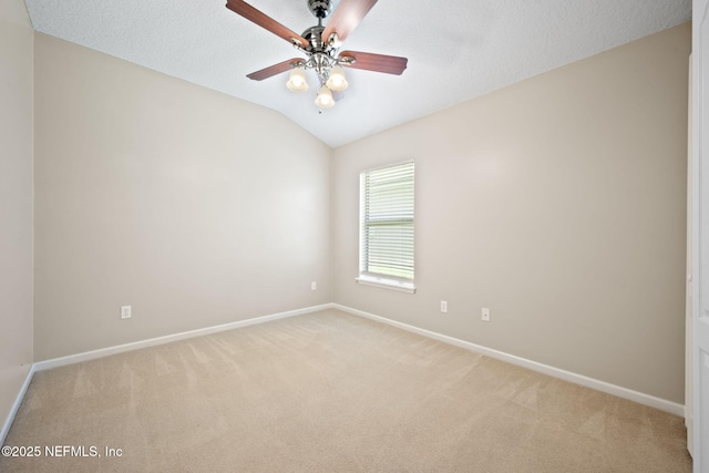96316 Ridgewood Cir, Fernandina Beach, FL 32034 - unfurnished room featuring light colored carpet, baseboards, lofted ceiling, and ceiling fan