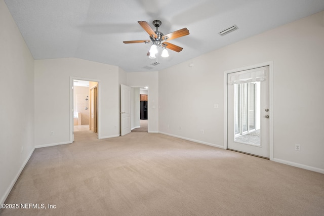 96316 Ridgewood Cir, Fernandina Beach, FL 32034 - unfurnished bedroom with light carpet, access to outside, baseboards, and vaulted ceiling