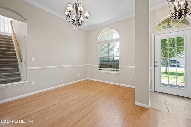 96316 Ridgewood Cir, Fernandina Beach, FL 32034 - entryway featuring a chandelier, healthy amount of natural light, wood-type flooring, and ornamental molding
