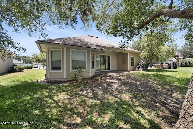 96316 Ridgewood Cir, Fernandina Beach, FL 32034 - rear view of property featuring a yard