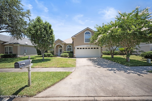 96316 Ridgewood Cir, Fernandina Beach, FL 32034 - view of front of home with an attached garage, concrete driveway, a front lawn, and stucco siding