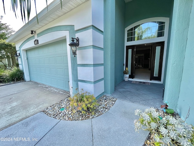 view of exterior entry featuring a garage