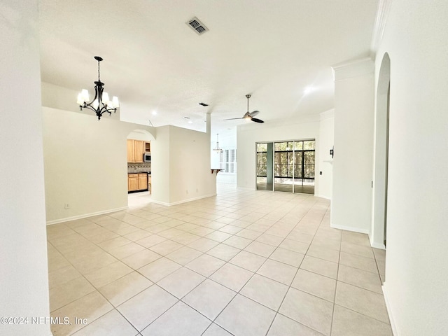 unfurnished living room featuring light tile patterned floors, ceiling fan with notable chandelier, and ornamental molding