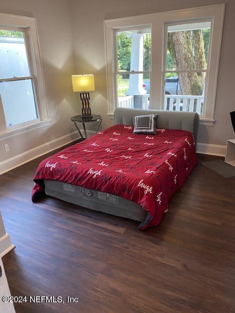 bedroom featuring dark hardwood / wood-style flooring