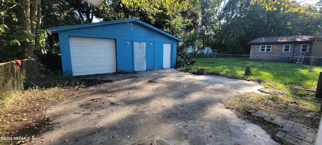 garage with a yard