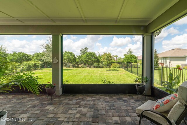 unfurnished sunroom featuring plenty of natural light