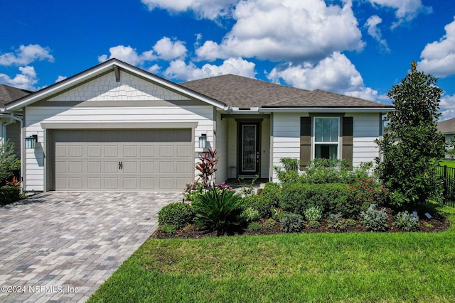 ranch-style house with a garage and a front lawn