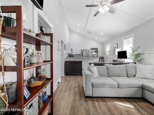 2745 Gilmore St, Jacksonville, FL 32205 - living area with light wood finished floors, beam ceiling, recessed lighting, ceiling fan, and high vaulted ceiling