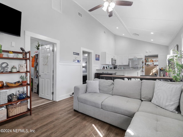 2745 Gilmore St, Jacksonville, FL 32205 - living room with recessed lighting, wood finished floors, a ceiling fan, and high vaulted ceiling