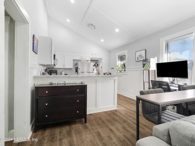 2745 Gilmore St, Jacksonville, FL 32205 - interior space featuring white cabinets, dark wood finished floors, recessed lighting, stainless steel appliances, and a peninsula