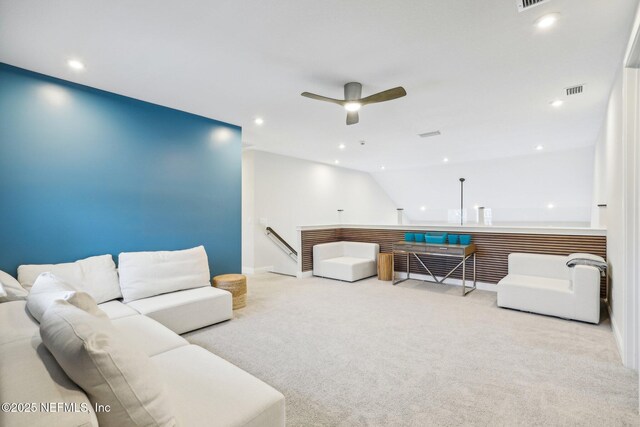 living area with carpet floors, visible vents, a ceiling fan, and recessed lighting