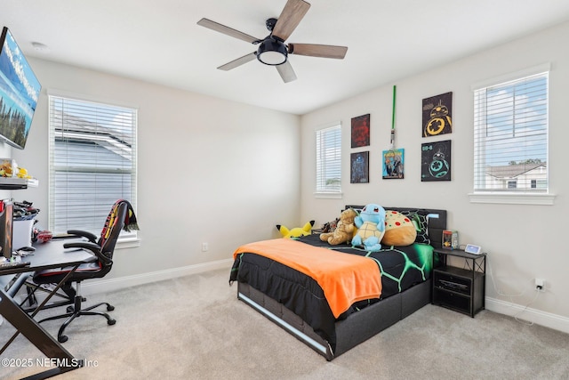 bedroom with carpet flooring, ceiling fan, and baseboards