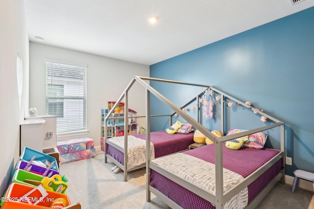 carpeted bedroom with baseboards