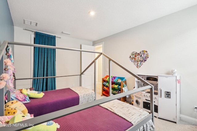 carpeted bedroom with visible vents