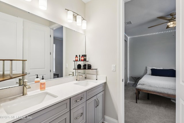 full bathroom featuring double vanity, ceiling fan, visible vents, and a sink