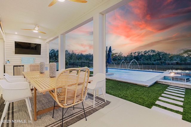 view of patio / terrace with fence, a fenced in pool, and outdoor dining space