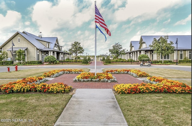 view of property's community with a yard