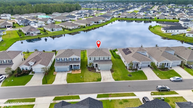 drone / aerial view with a water view