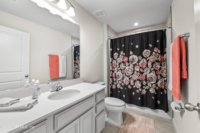 full bathroom with shower / bathtub combination with curtain, vanity, a textured ceiling, tile patterned flooring, and toilet