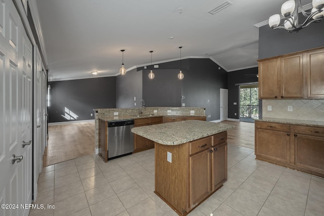 kitchen with a notable chandelier, lofted ceiling, stainless steel dishwasher, decorative light fixtures, and a kitchen island