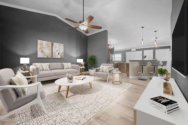 living room with light hardwood / wood-style flooring, ceiling fan, lofted ceiling, and crown molding