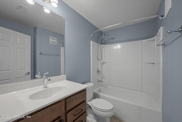 full bathroom with a textured ceiling, vanity, toilet, and shower / bathtub combination