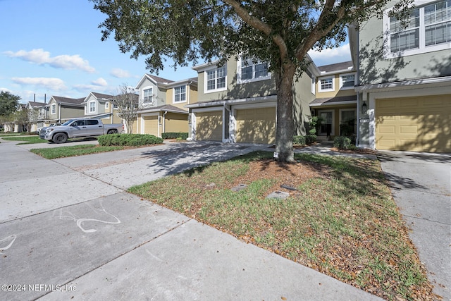 multi unit property featuring a garage