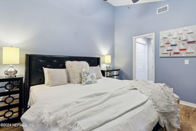 bedroom featuring hardwood / wood-style flooring and a closet