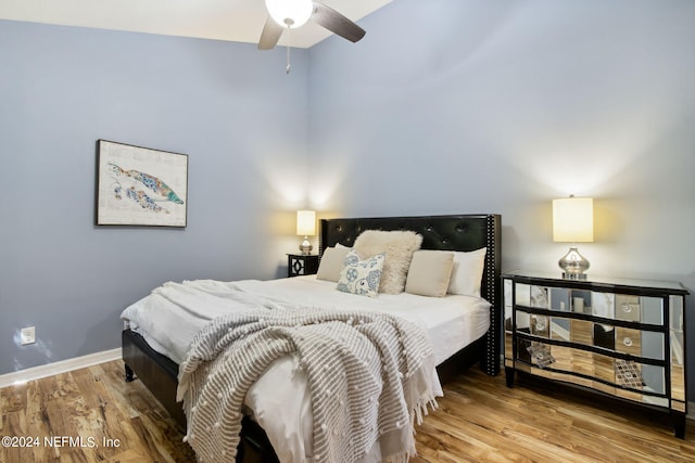 bedroom featuring wood-type flooring and ceiling fan