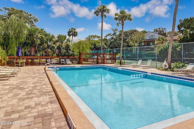 view of pool featuring a patio