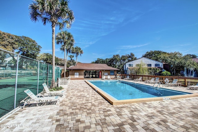 view of swimming pool with a patio