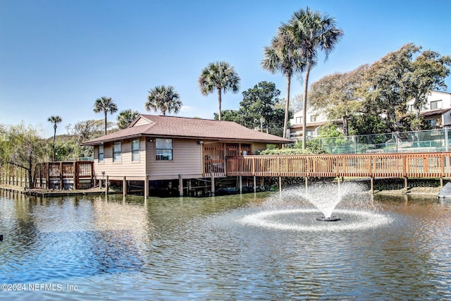 view of dock with a deck with water view