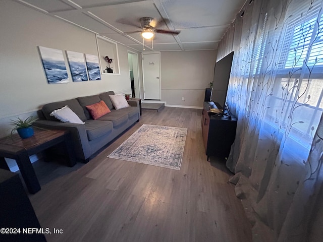 living room featuring ceiling fan and hardwood / wood-style flooring