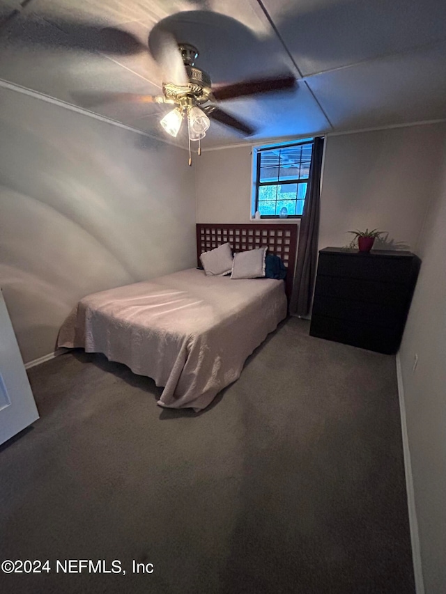 bedroom with ceiling fan and carpet floors