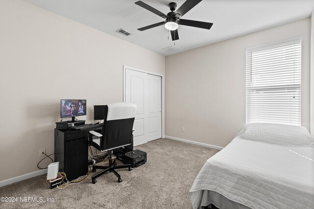 carpeted bedroom with ceiling fan