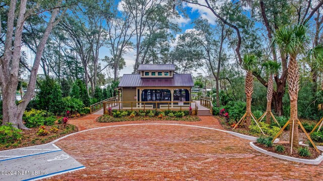 back of property featuring a sunroom