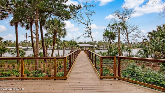 deck featuring a gazebo and a water view