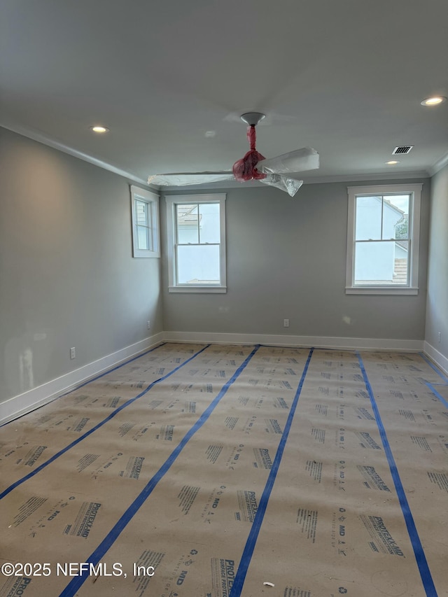 unfurnished room with crown molding and ceiling fan