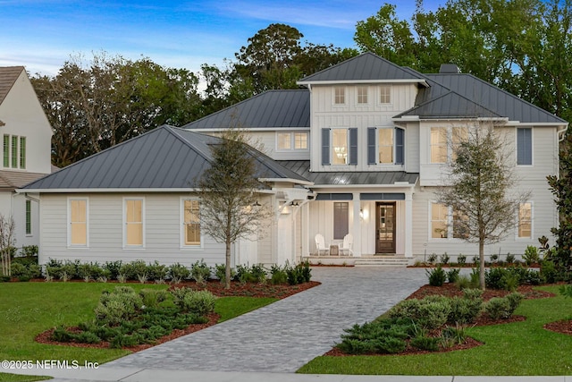 354 River Breeze Dr Lot 3, Ponte Vedra, FL 32081 - view of front of house featuring a standing seam roof, metal roof, board and batten siding, decorative driveway, and a front yard