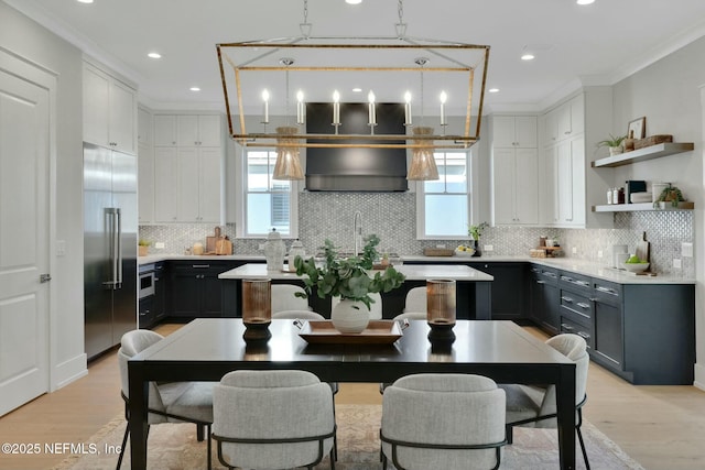 354 River Breeze Dr Lot 3, Ponte Vedra, FL 32081 - kitchen featuring light wood finished floors, light countertops, ornamental molding, and appliances with stainless steel finishes