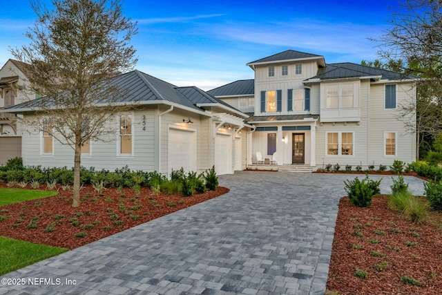 354 River Breeze Dr Lot 3, Ponte Vedra, FL 32081 - view of front of property featuring metal roof, decorative driveway, an attached garage, a standing seam roof, and board and batten siding