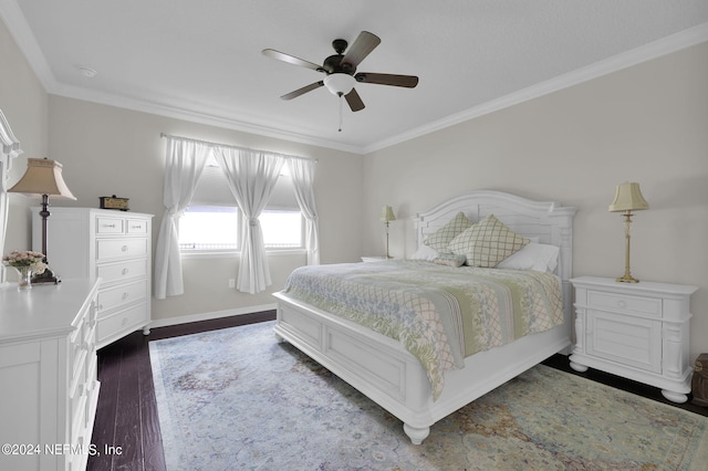 bedroom with ceiling fan, dark hardwood / wood-style flooring, and crown molding