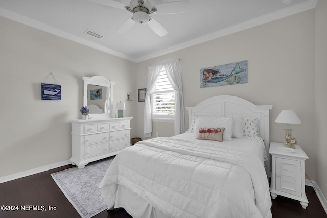 bedroom with ceiling fan, dark hardwood / wood-style flooring, and crown molding