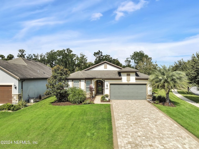 view of front facade with a front lawn and a garage