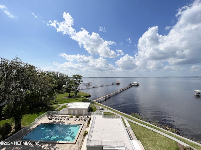 birds eye view of property with a water view